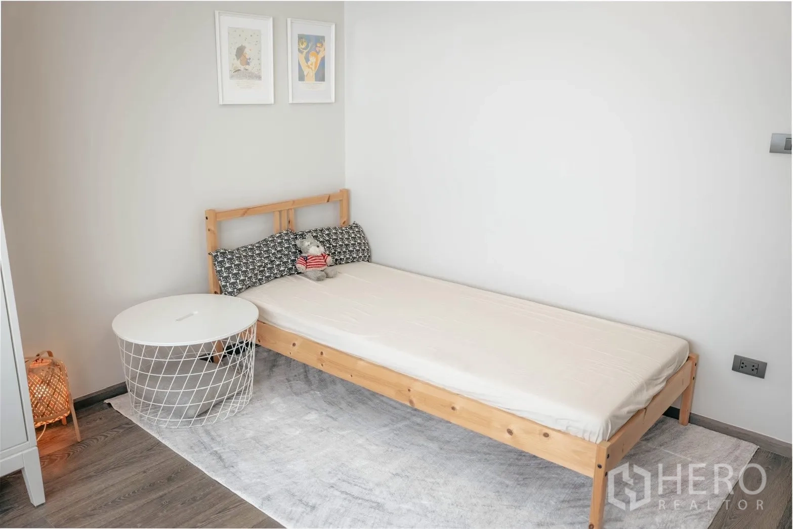 Detached House for rent or sale in Bang Phli, Samut Prakan - Third bedroom with single wooden bed and light rug.