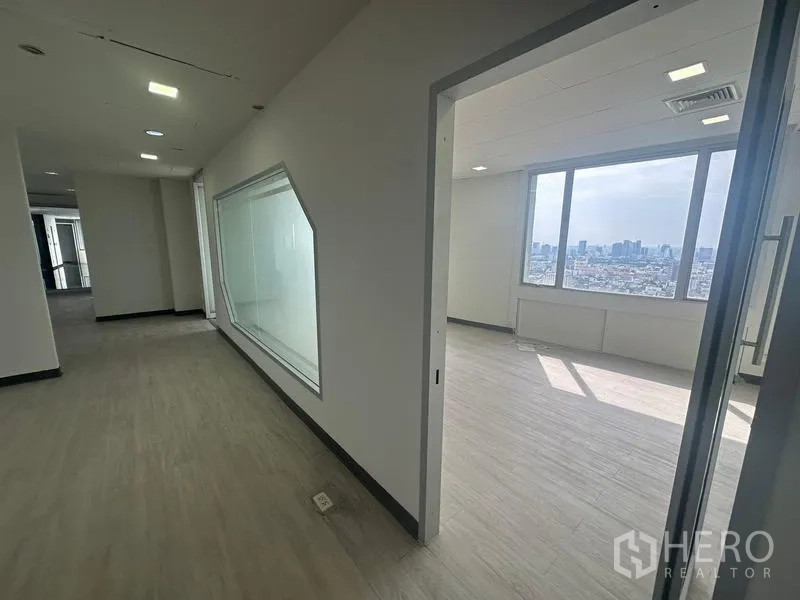 Office Space for rent - Work area with triple-window frontage delivering abundant natural light and city views.