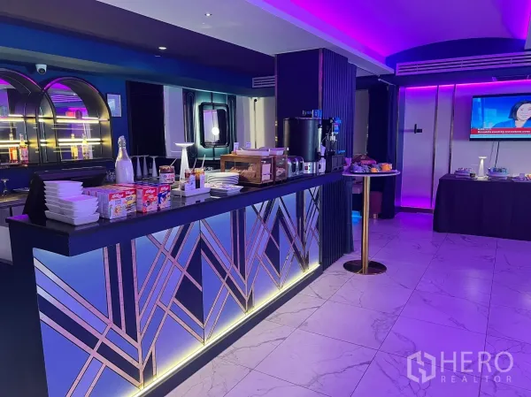Retail Space for rent - Service counter with cereals and coffee machines beside illuminated shelving and a geometric bar front.
