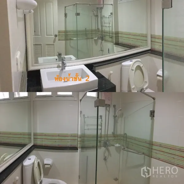Detached House for sale in Lat Krabang, Bangkok - Second-floor bathroom with glass-enclosed shower, large mirror, vanity and toilet.