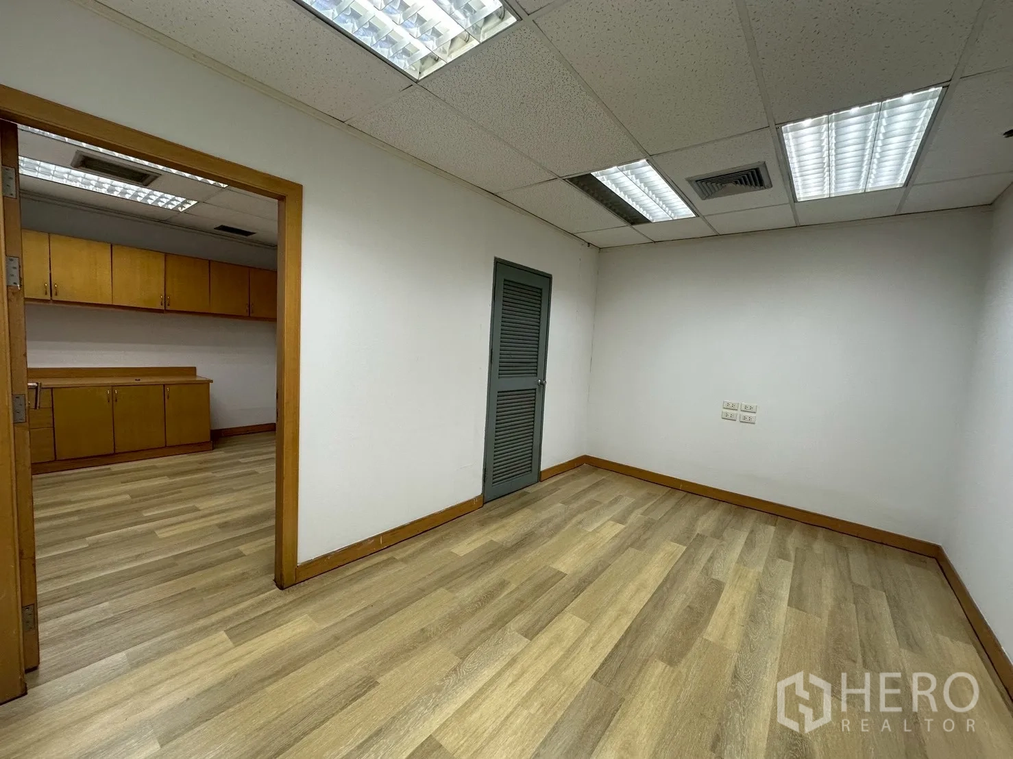 Office Space for rent - Small utility room connecting to storage area with louvered door.