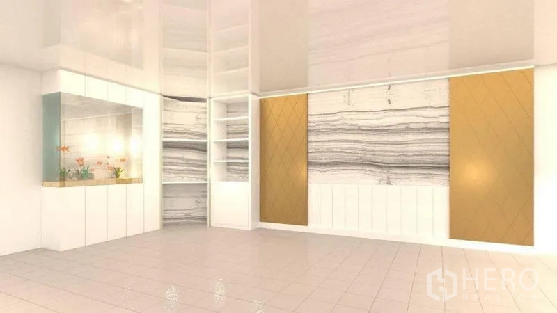 Detached House for rent in Lat Phrao, Bangkok - Multipurpose living space with built-in shelving, feature panels and illuminated aquarium.
