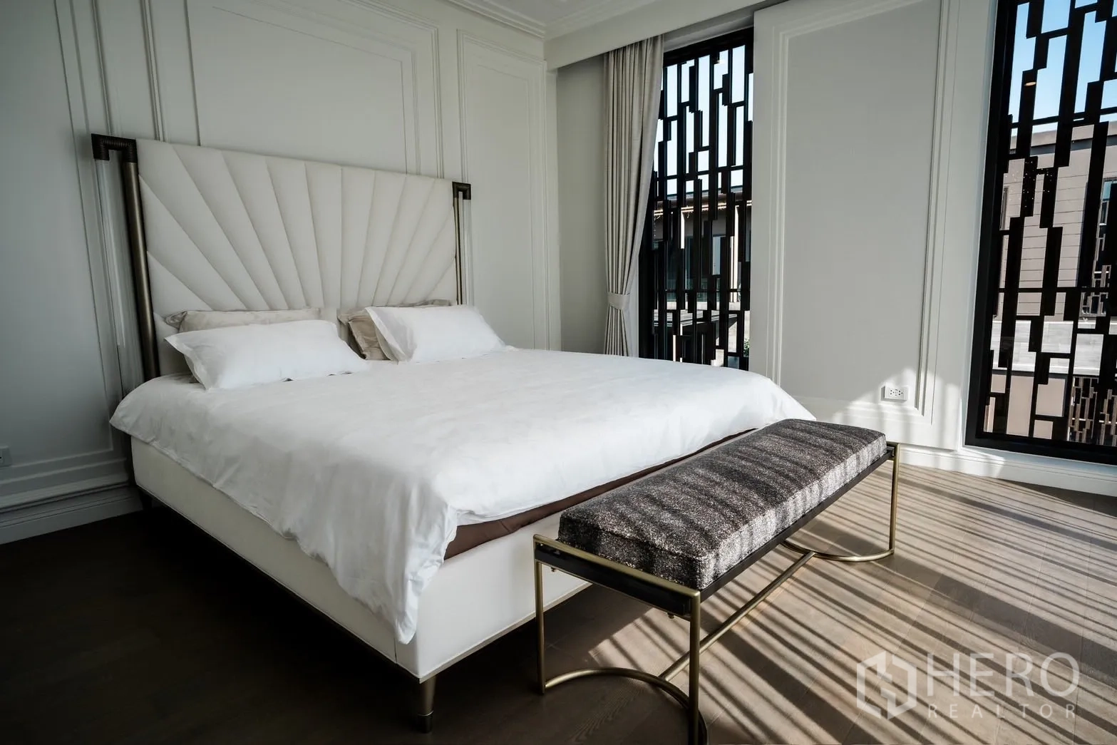 Detached House for rent or sale in Bang Kapi, Bangkok - Secondary bedroom with designer headboard, large bed and floor‑to‑ceiling windows.