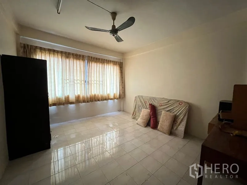 Shophouse for sale in Phra Khanong, Bangkok - Sunlit room with long curtains, tiled flooring and ceiling fan.