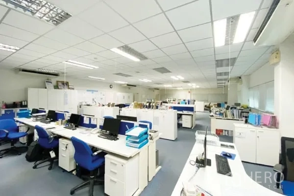 Factory for sale in Rayong - Open-plan office with desks, computers, cabinets and bright ceiling lights.