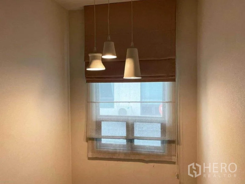 Detached House for sale in Prawet, Bangkok - Cozy window nook with three pendant lights and a roman shade.
