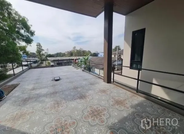 Detached House for sale in Sai Mai, Bangkok - Expansive second-floor terrace with patterned tiles and metal railing overlooking the neighborhood.