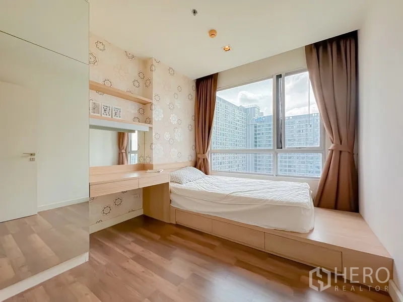 Condominium for sale - Second bedroom with platform bed, built-in desk and large window with city view.