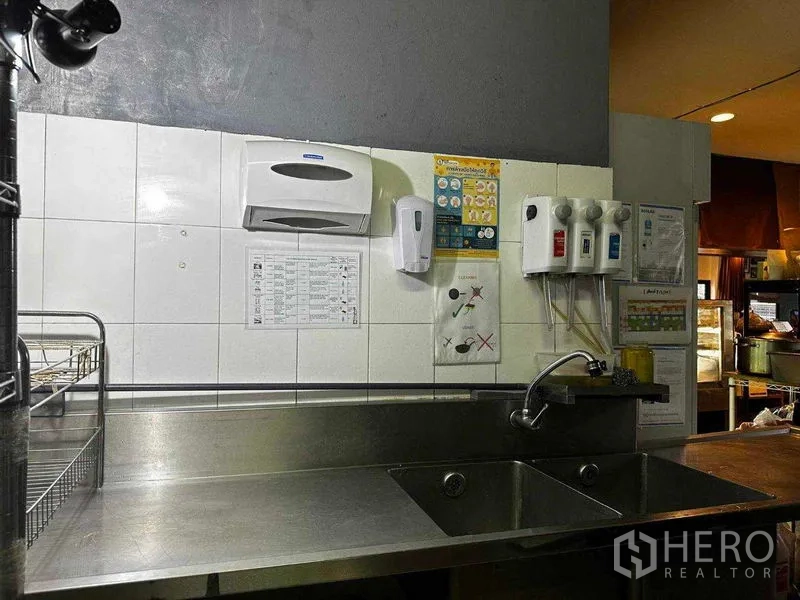Retail Space for rent in Watthana, Bangkok - Double sink and hygiene stations opening toward the dining area.