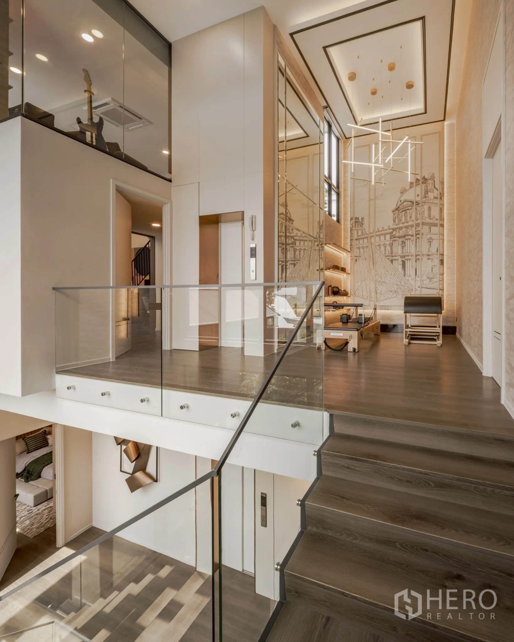Detached House for rent in Saphan Sung, Bangkok - Upper landing with private home elevator and fitness corner beneath designer lighting.
