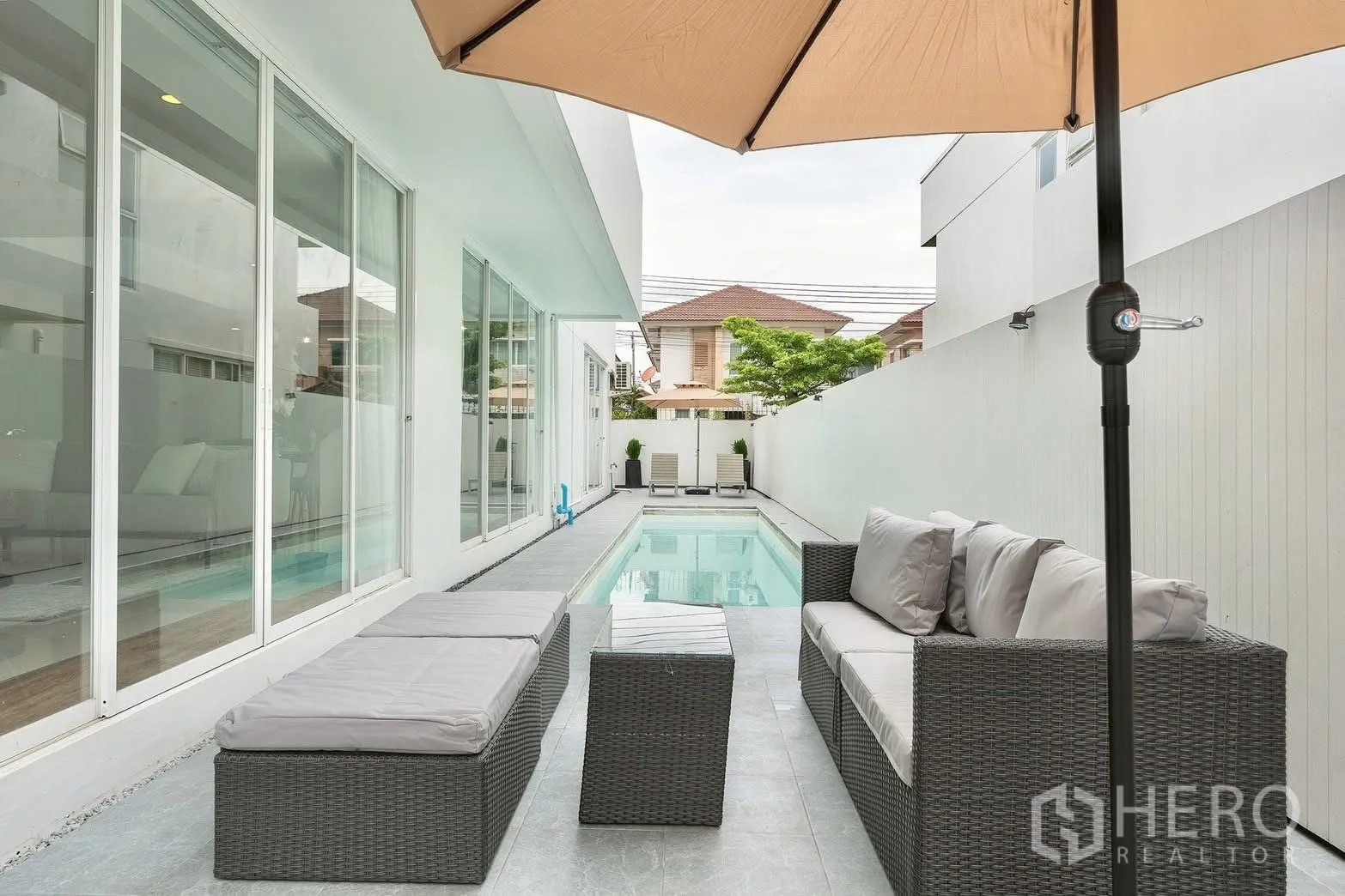 Detached House for rent in Saphan Sung, Bangkok - Outdoor seating terrace beside a narrow private lap pool.
