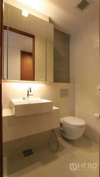 Condominium for rent - Contemporary bathroom with mirrored cabinet, square basin and wall‑hung toilet.