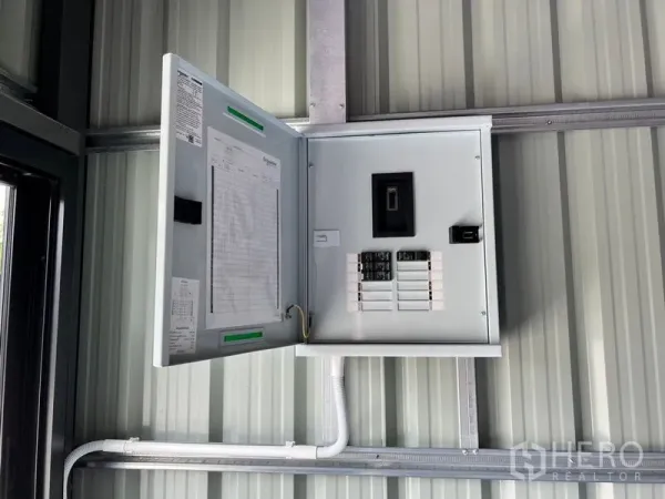 Warehouse for rent in Lat Phrao, Bangkok - Electrical distribution panel mounted on the warehouse’s metal wall.