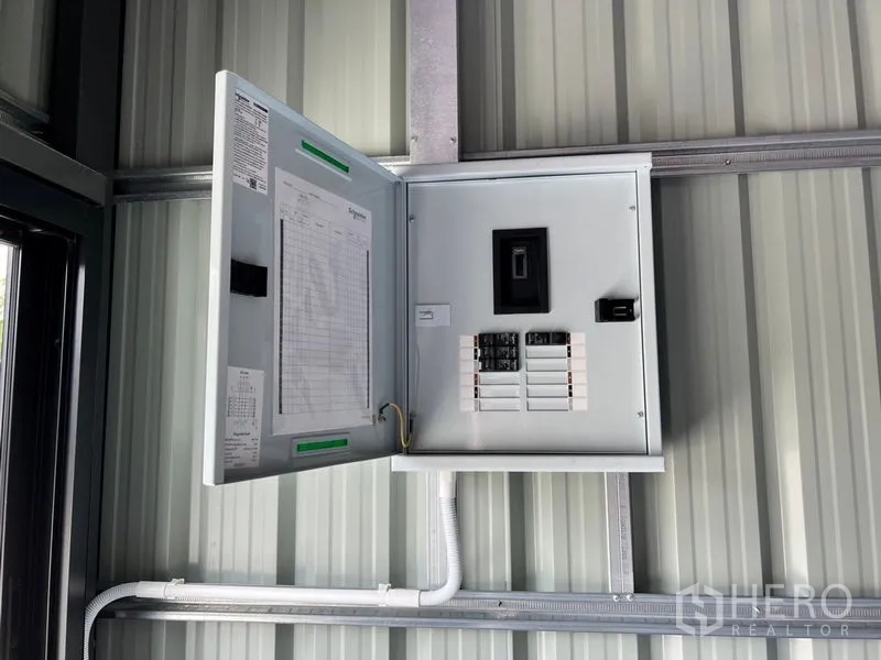 Warehouse for rent in Lat Phrao, Bangkok - Electrical distribution panel mounted on the warehouse’s metal wall.