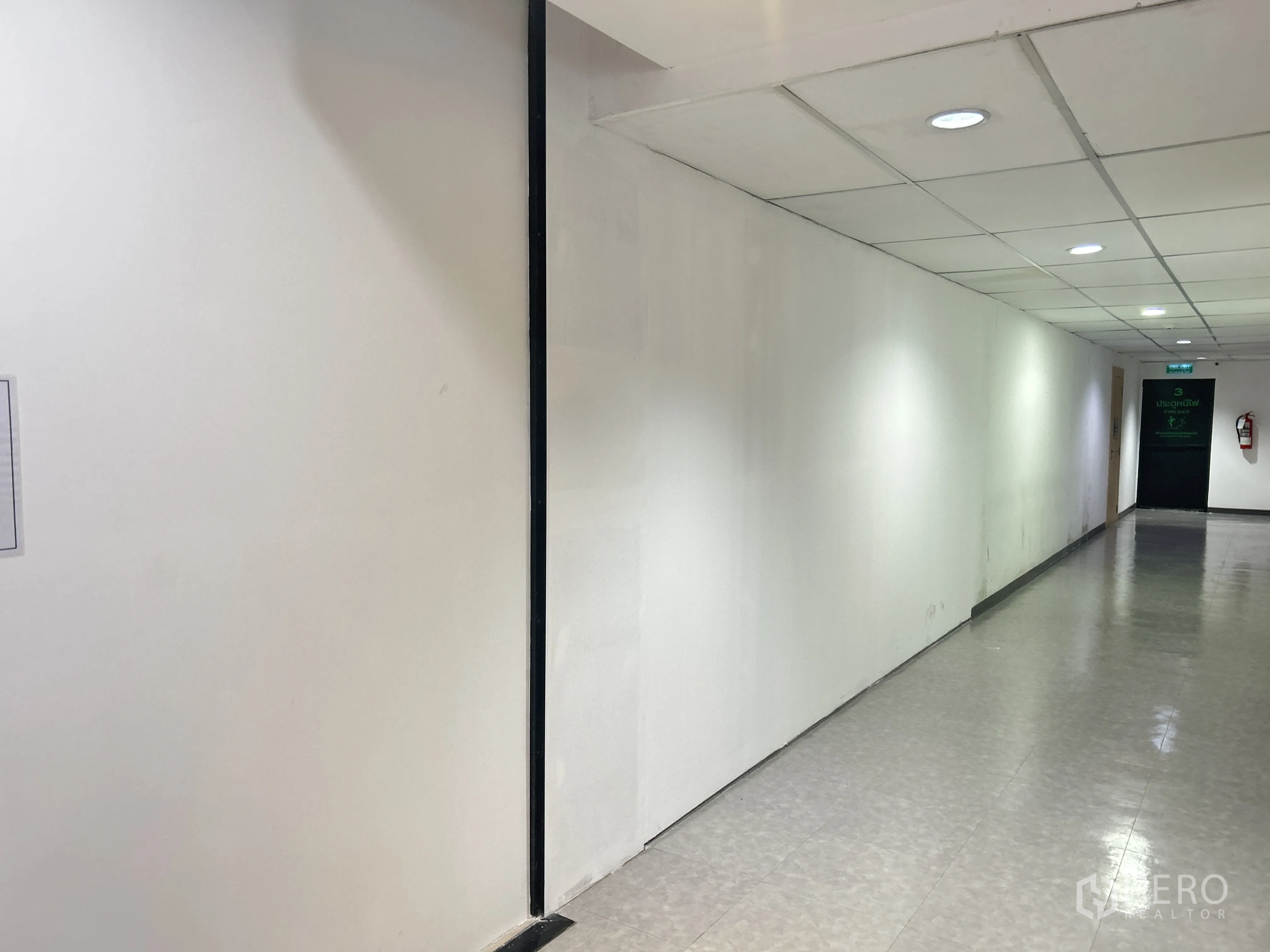 Retail Space for rent in Pathum Wan, Bangkok - Bright interior corridor with white walls and recessed ceiling lights.
