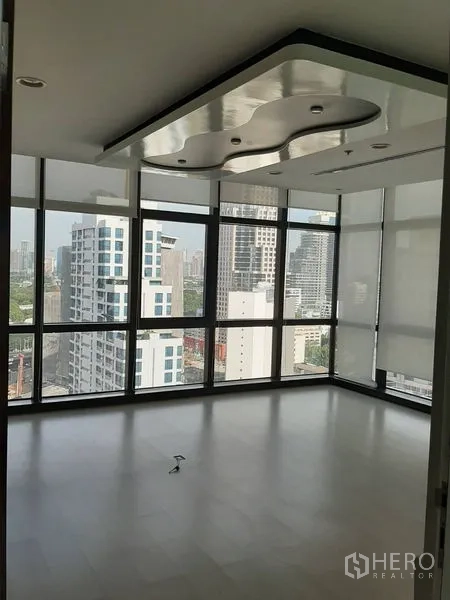 Office Space for rent in Bang Rak, Bangkok - Corner meeting or executive room with wraparound windows and a sculpted feature ceiling.