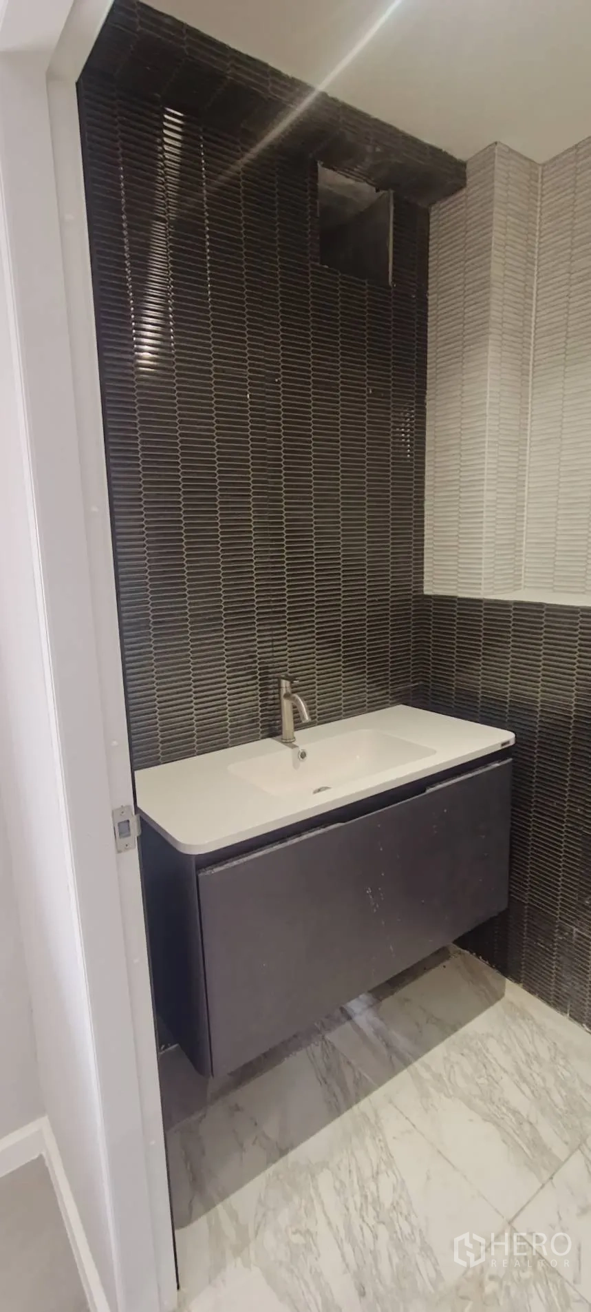 Office Space for rent in Watthana, Bangkok - Vanity sink with modern faucet and textured tile backsplash.