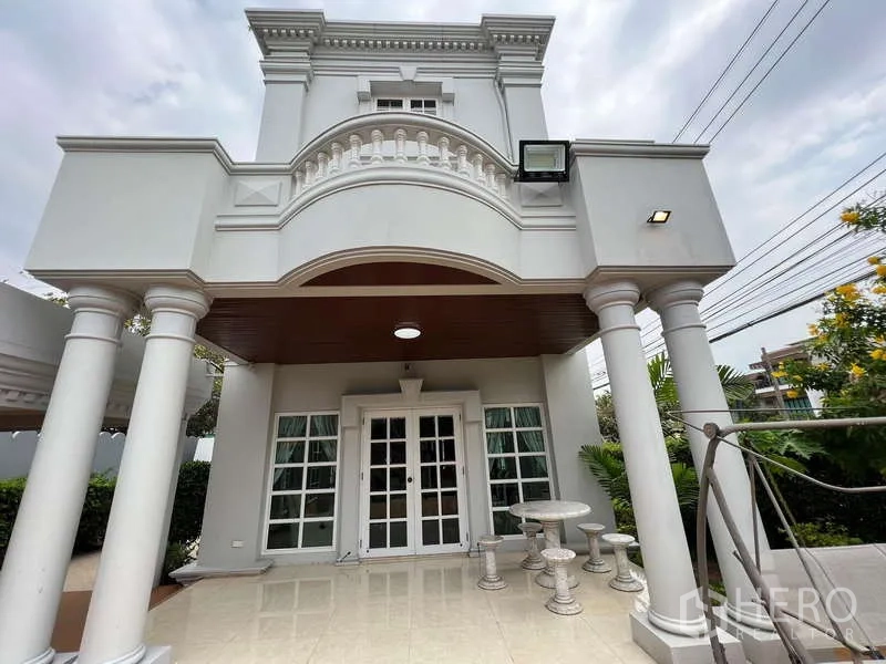 Detached House for rent in Bang Phli, Samut Prakan - Neoclassical front porch with twin columns, balcony, and double French doors.