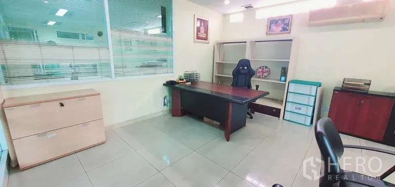 Office Space for rent in Bang Kho Laem, Bangkok - Private executive office with desk, shelving, tiled floor and air-conditioning.