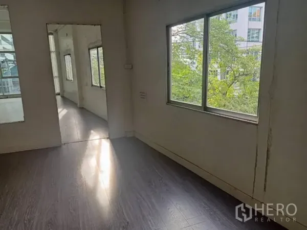 Retail Space for rent in Watthana, Bangkok - Secondary room with a large window, greenery views, and access to the main area.