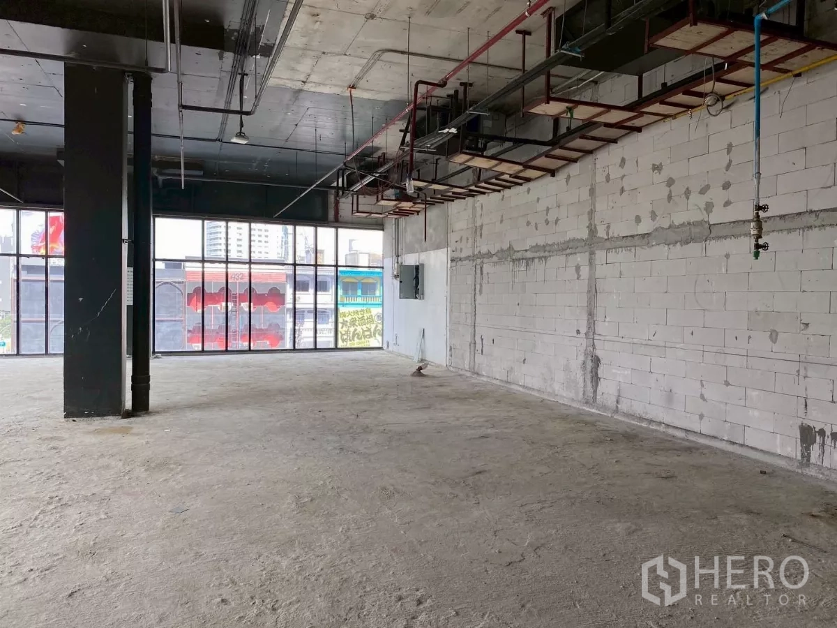 Retail Space for rent - Open space with wraparound windows and city street outlook, ready for fit-out.