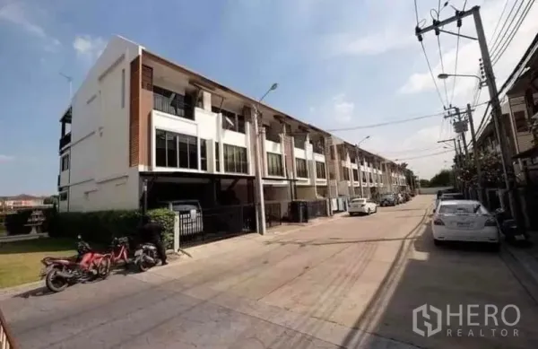 Townhouse for rent - Three-storey modern townhouse row with gated carports on a quiet street in Phra Khanong.