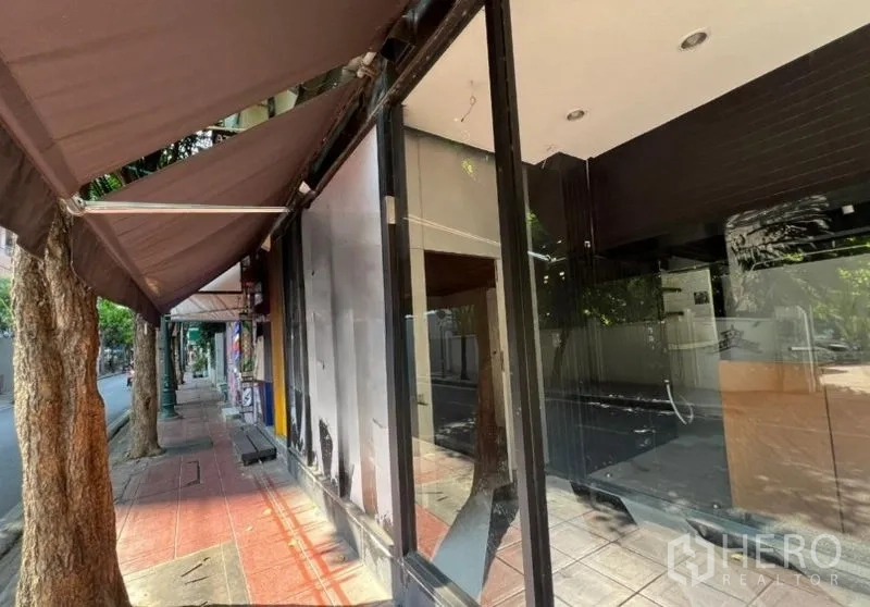 Retail Space for rent in Bang Rak, Bangkok - Sidewalk view of the shopfront with awnings and large glass panels.