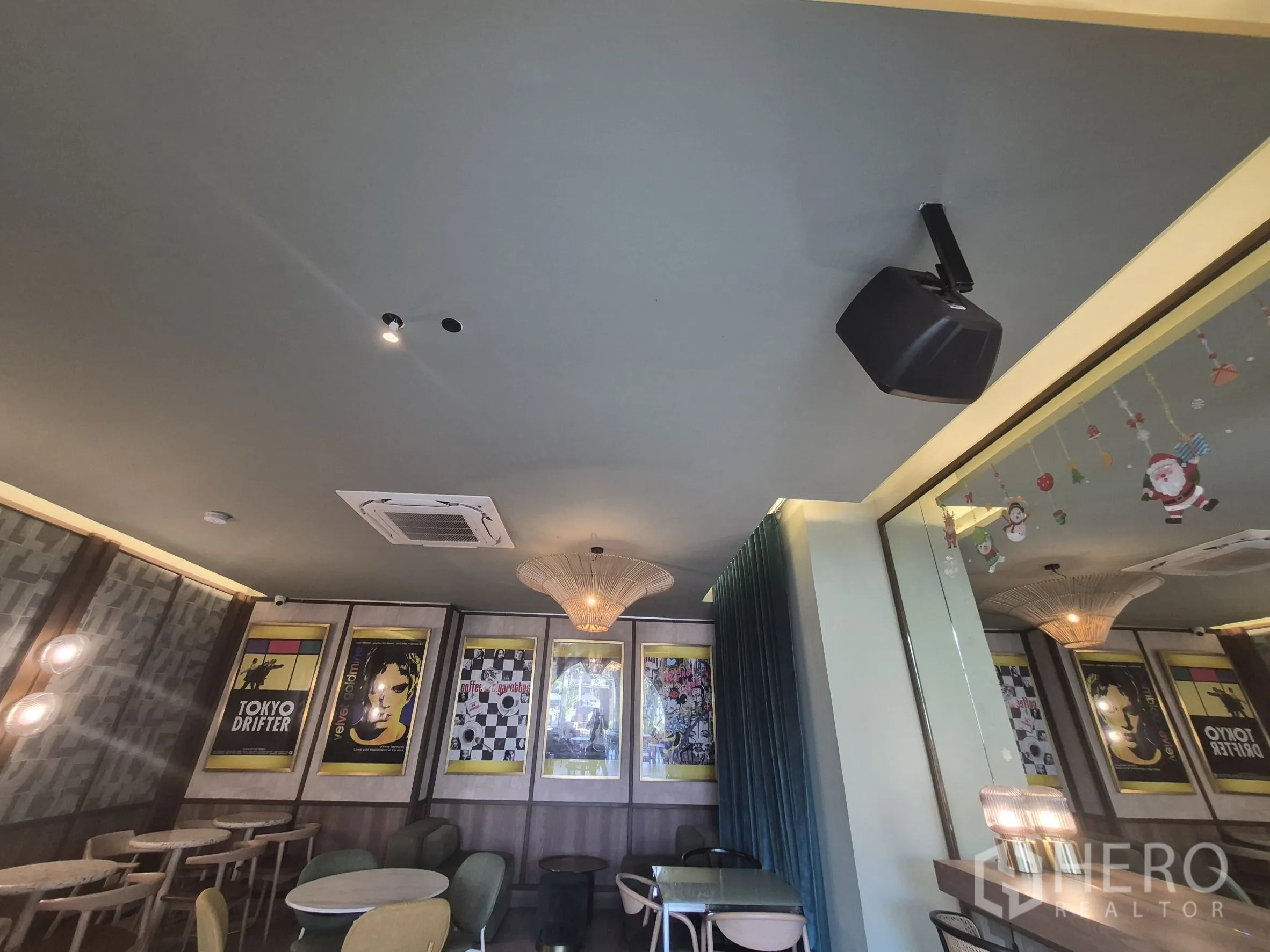 Retail Space for rent in Watthana, Bangkok - Ceiling view showing cassette air-conditioning, pendant lighting, and mirrored wall accents.