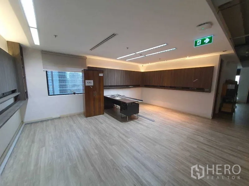 Office Space for rent in Watthana, Bangkok - Fitted office area with built-in wood cabinetry and LED lighting.
