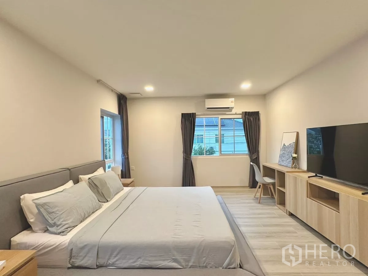 Detached House for rent in Bang Phli, Samut Prakan - Alternate master bedroom angle showing TV console and full-height closets.
