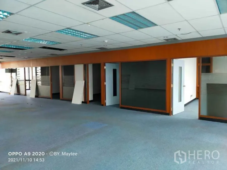 Office Space for rent in Watthana, Bangkok - Wide view of the open office showing multiple glass-fronted rooms and ample natural light.