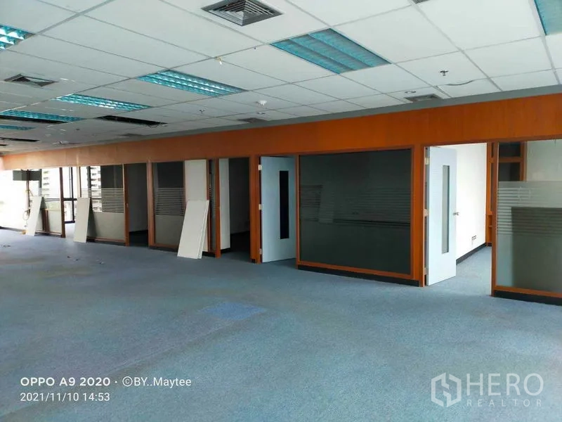Office Space for rent in Watthana, Bangkok - Wide view of the open office showing multiple glass-fronted rooms and ample natural light.