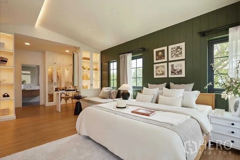 Detached House for sale in Bang Phli, Samut Prakan - Spacious master bedroom with feature wall, window seat and entry to a walk-in closet.