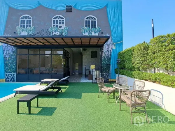 Retail Space for rent in Watthana, Bangkok - Pool deck with sun loungers, mural facade and glass doors opening to the terrace.