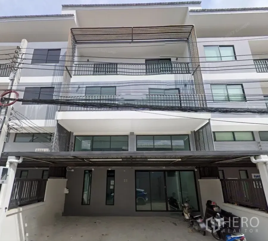 Home Office for rent or sale in Khlong Toei, Bangkok - Modern multi‑storey home office facade in Phra Khanong with balconies and ground‑floor glass entrance.