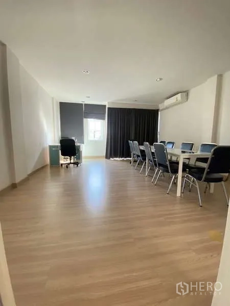Home Office for rent or sale - Large multipurpose room arranged as a meeting space with a long table and chairs.