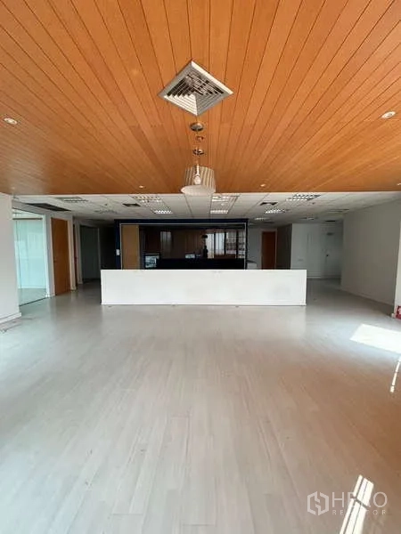 Office Space for rent in Bang Na, Bangkok - Spacious reception area with wood-paneled ceiling and a central counter.