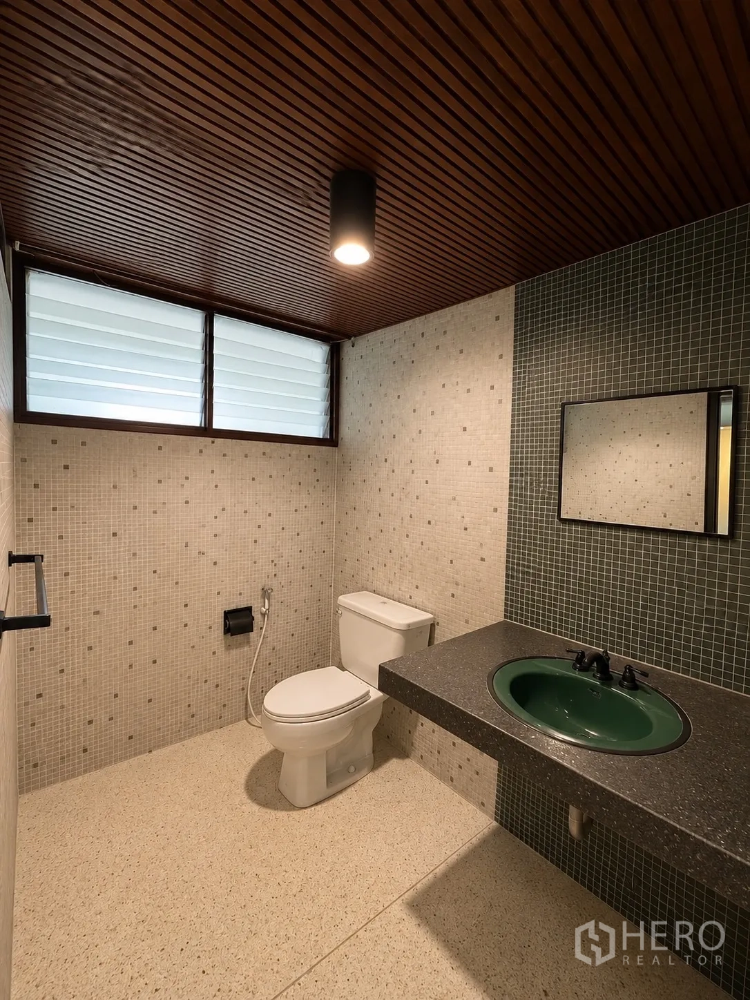 Office Space for rent in Phaya Thai, Bangkok - Second bathroom with mosaic tile walls, green basin, and toilet.