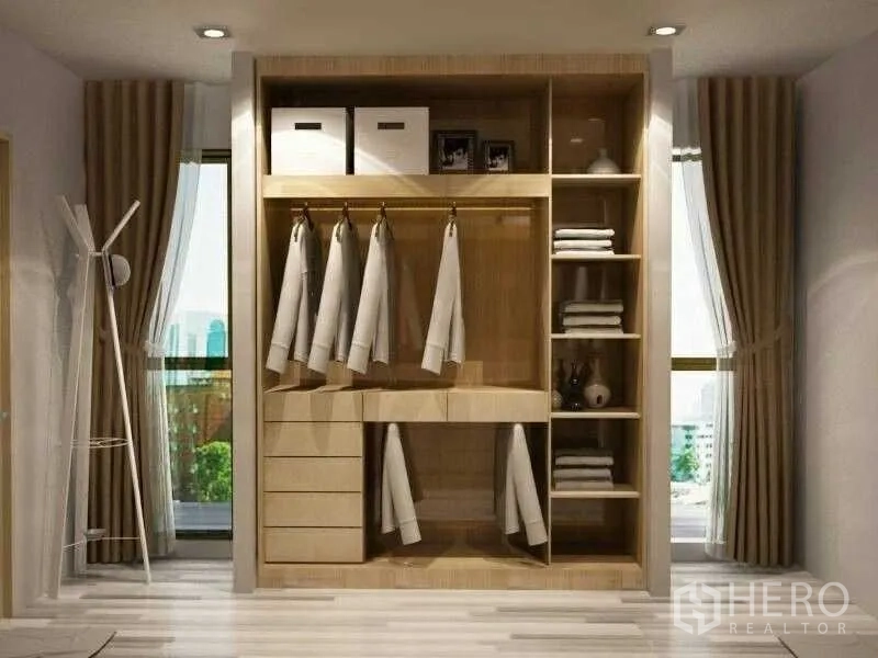 Detached House for rent in Prawet, Bangkok - Built-in wooden walk-in closet with shelves, drawers, and hanging space.