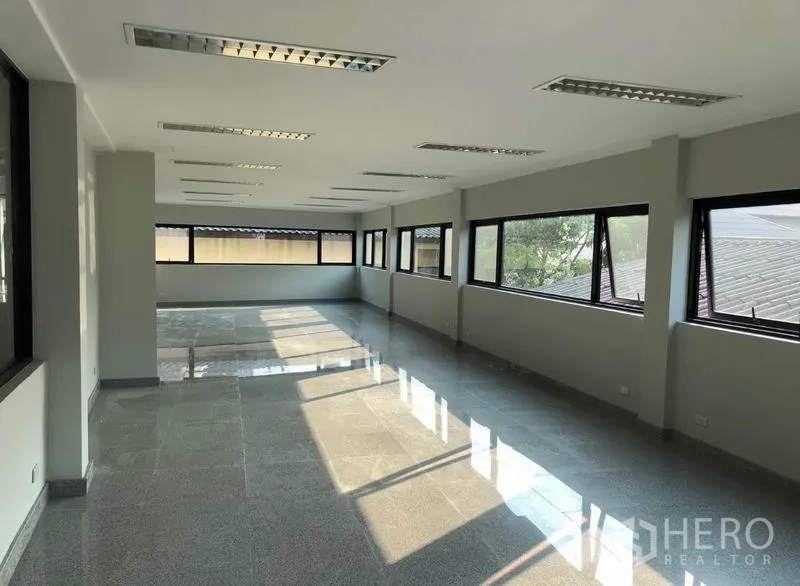Office Space for rent in Khlong Toei, Bangkok - Covered parking bays next to the office with clearly marked spaces.