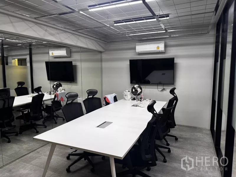 Office Space for rent or sale in Suan Luang, Bangkok - Rooftop terrace at night with covered dining area, seating and landscaped greenery.