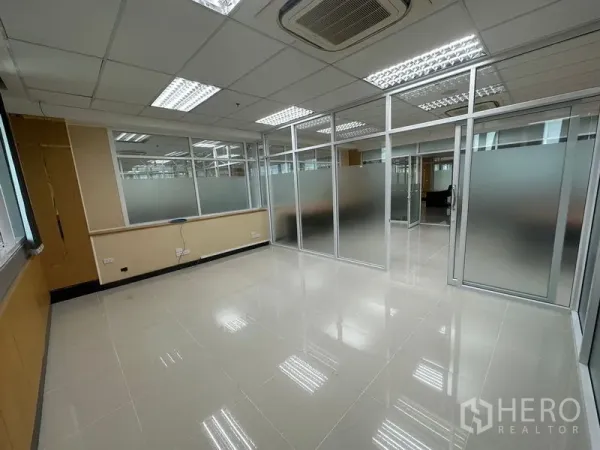 Office Space for rent in Suan Luang, Bangkok - Empty private office with floor-to-ceiling frosted glass sliding doors and a side window for natural light.