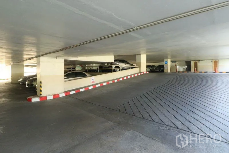 Office Space for rent in Bang Rak, Bangkok - Covered multi-level parking garage with ramp and parked cars