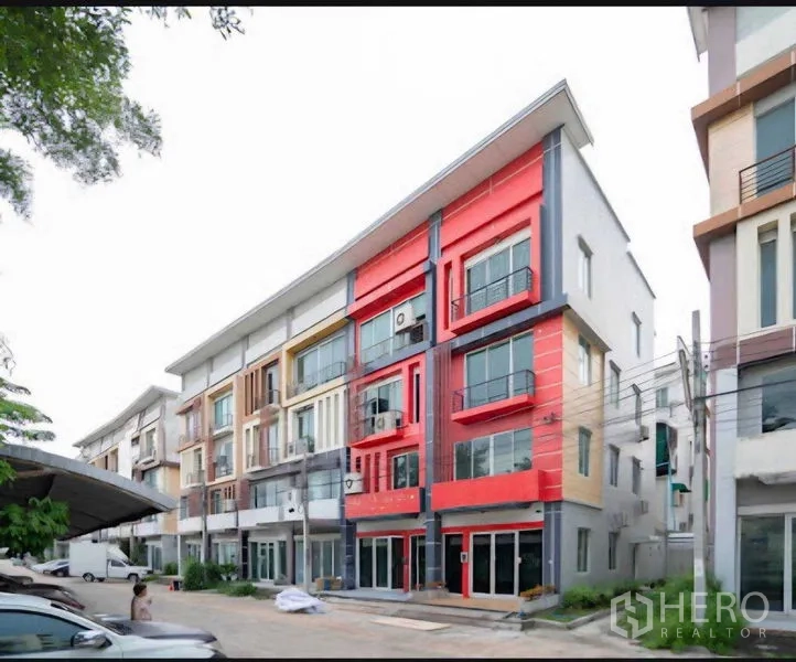Home Office for rent or sale in Lat Krabang, Bangkok - Modern four-storey home office row with colorful facade and front parking in Lat Krabang, Bangkok.