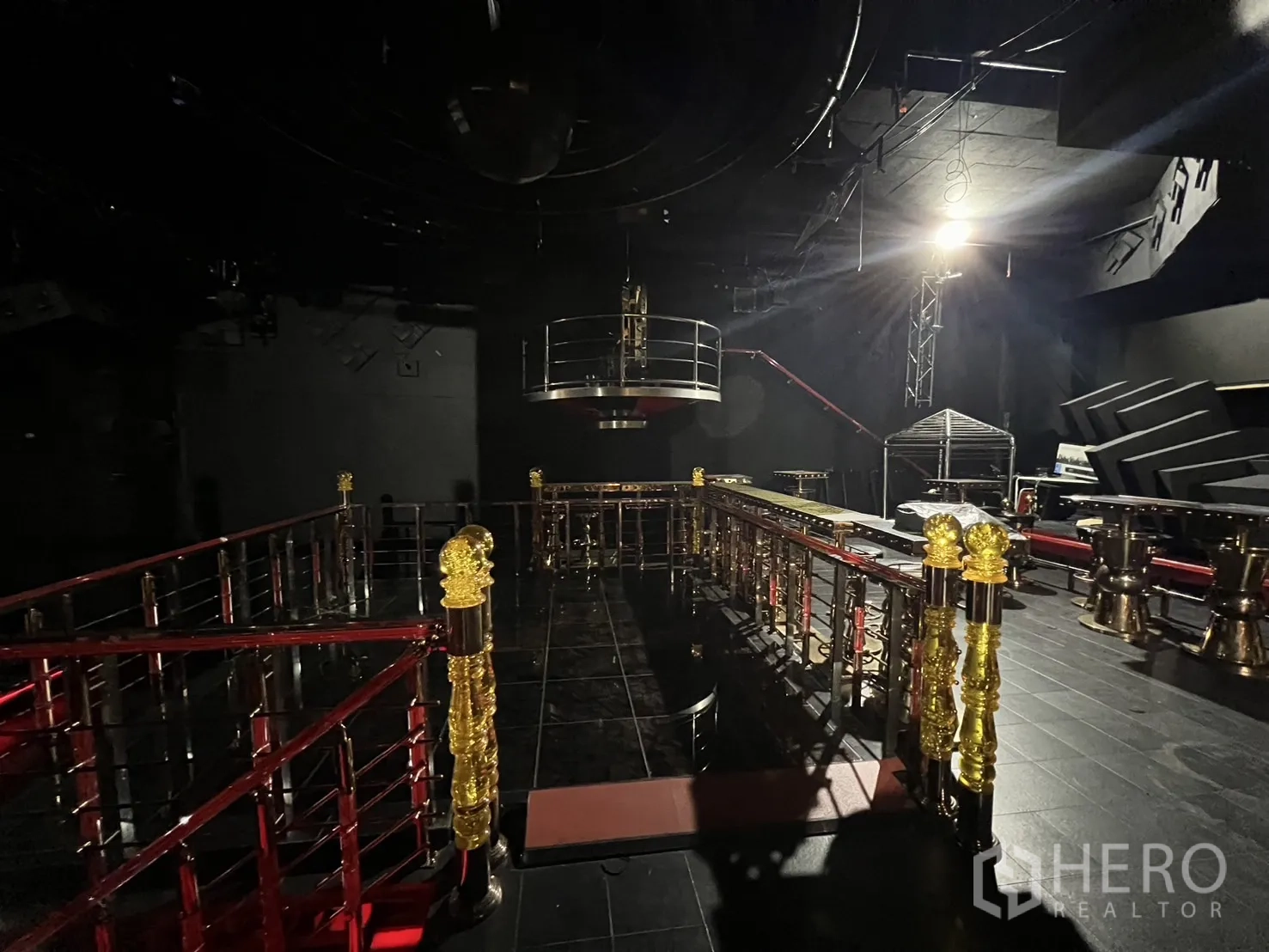 Retail Space for rent - Mezzanine walkway with decorative posts and a suspended round booth over the dance floor.