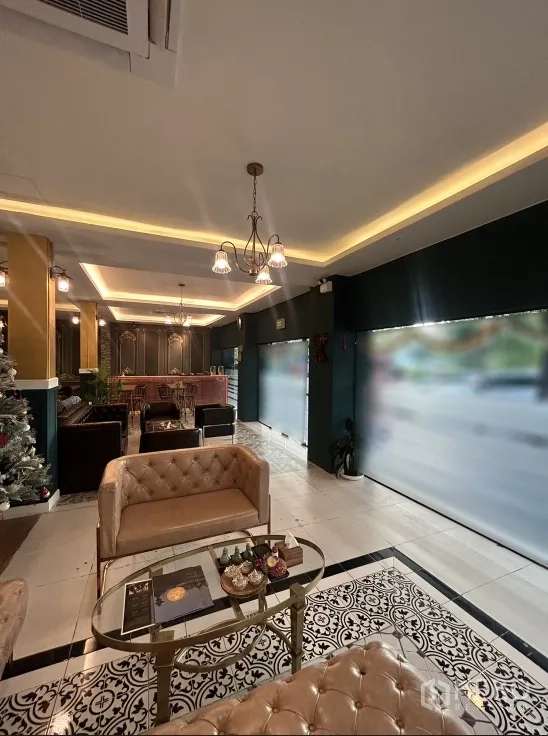 Retail Space for rent in Khlong Toei, Bangkok - Elegant retail interior with chandeliers, tufted sofas, large display windows, and patterned tile accents.