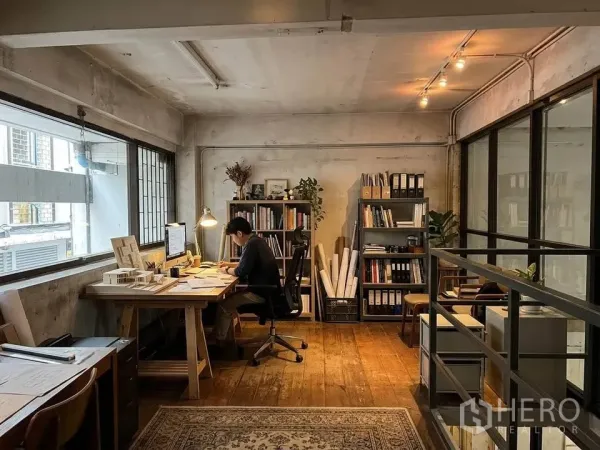 Retail Space for rent in Watthana, Bangkok - Mezzanine office area with large windows, desk, shelving, and wood flooring.