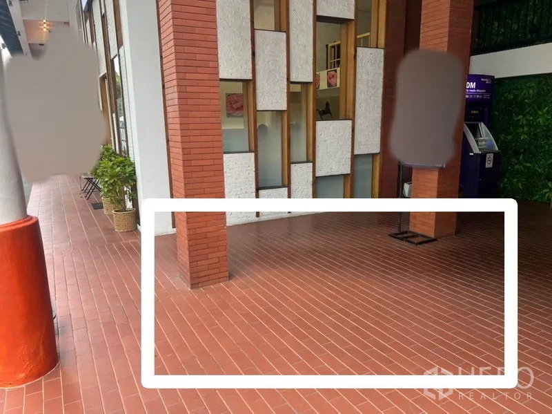 Retail Space for rent - Compact kiosk space marked on terracotta-tiled walkway beside a brick column and ATM, offering prominent frontage.