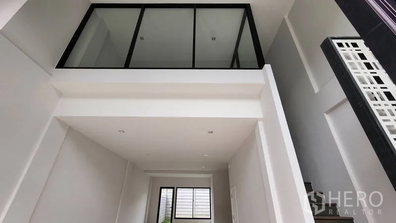Home Office for rent - Mezzanine-style internal window overlooking the double-height lobby.