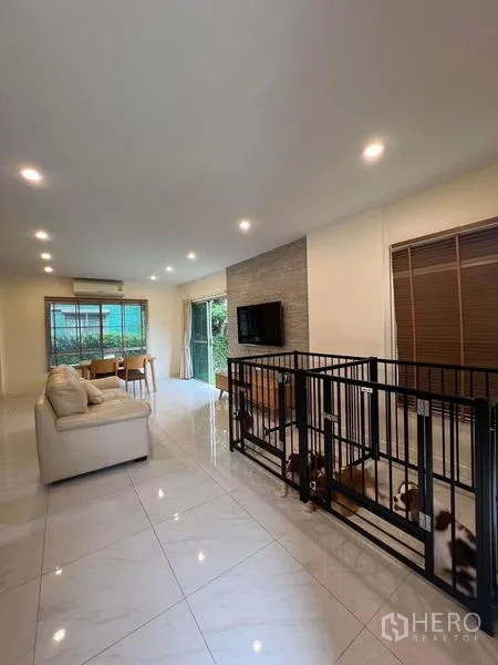 Detached House for sale in Bang Kruai, Nonthaburi - Front facade with gated driveway, covered carport and small garden.